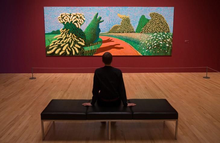 "May Blossom on the Roman Road, 2009" de l'artiste britannique David Hockney, à la Tate Britain de Londres, le 6 février 2017 / AFP/Archives Qu'est-ce qui fait d'un peintre une star populaire?