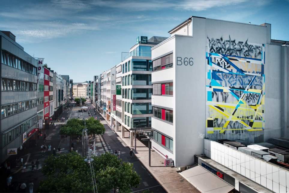 Mural #2: Sowat & Lek (Paris, FR) Sowat & Lek: Saarbroken, Bahnhofstraße 66, 66111 Sarrebruck (zone piétonne) - Mois: mai (Photo: Axl Klein) Sowat et Lek font partie des plus importants représentants