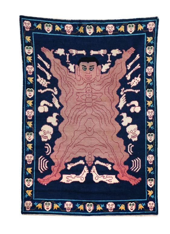 176 - Grand tapis Tantrique en laine Tibet XIXème siècle. Très rare tapis entouré d une bordure de membres découpés, rituel figurant la peau d un démon utilisé lors des danses du Cham.