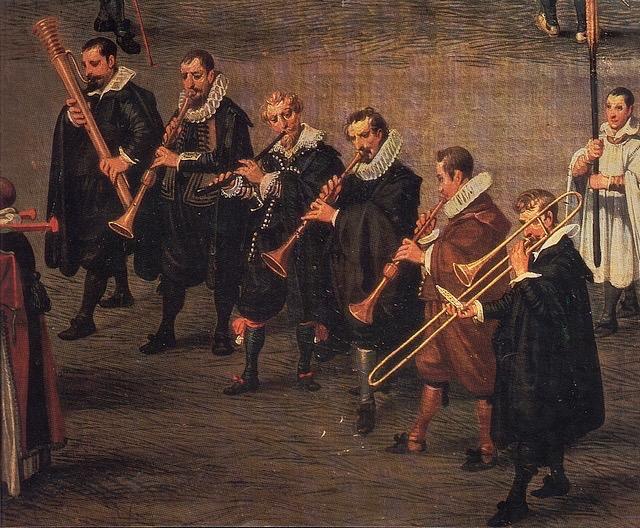 - 40 - Musiciens de ville, Denis van Alsloot, 1616 (Prado, Madrid) Le musicien de gauche nous montre une doulciane basse, l ancêtre du basson.