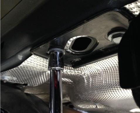 . Lower exhaust by removing the () 8mm