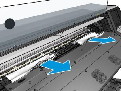 Du haut de l'imprimante, retirez délicatement le plus possible de substrat bourré. Si nécessaire, coupez le substrat.