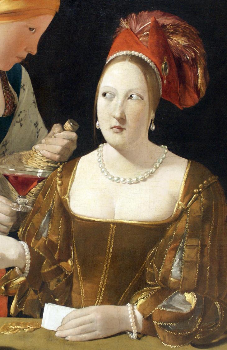 Image 2 Ce que l on voit - une femme avec une coiffe rouge - elle est habillée de vêtements d une autre époque - elle regarde vers sa droite du coin de l œil - elle porte des bijoux - elle tient un